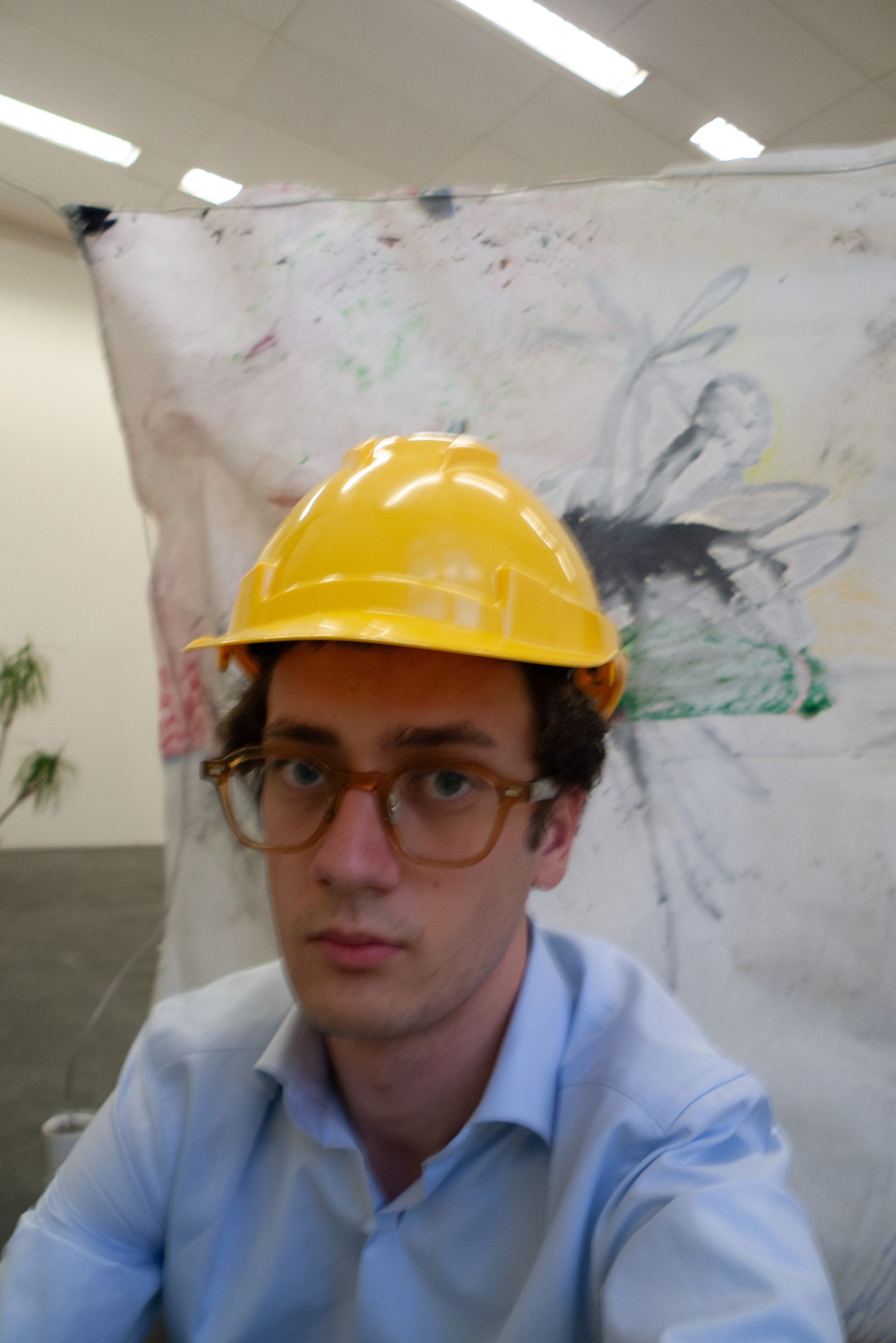 self-portrait of the artist wearing a protective helmet