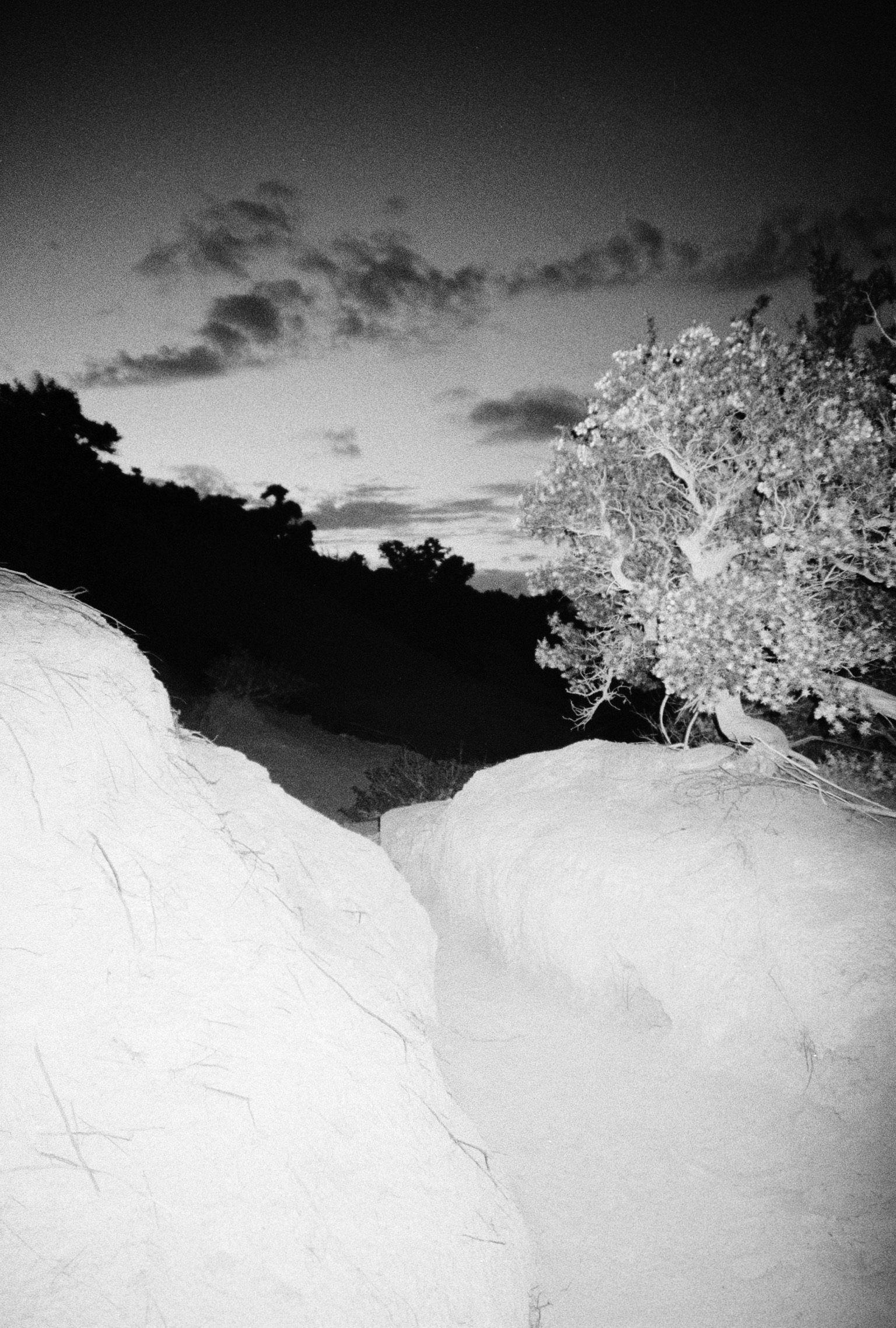 At night, the place becomes harsher, more eerie; the wind intensifies, and beyond the wind, there is almost nothing visible except the stars. Only with my flash can I imagine what things look like.