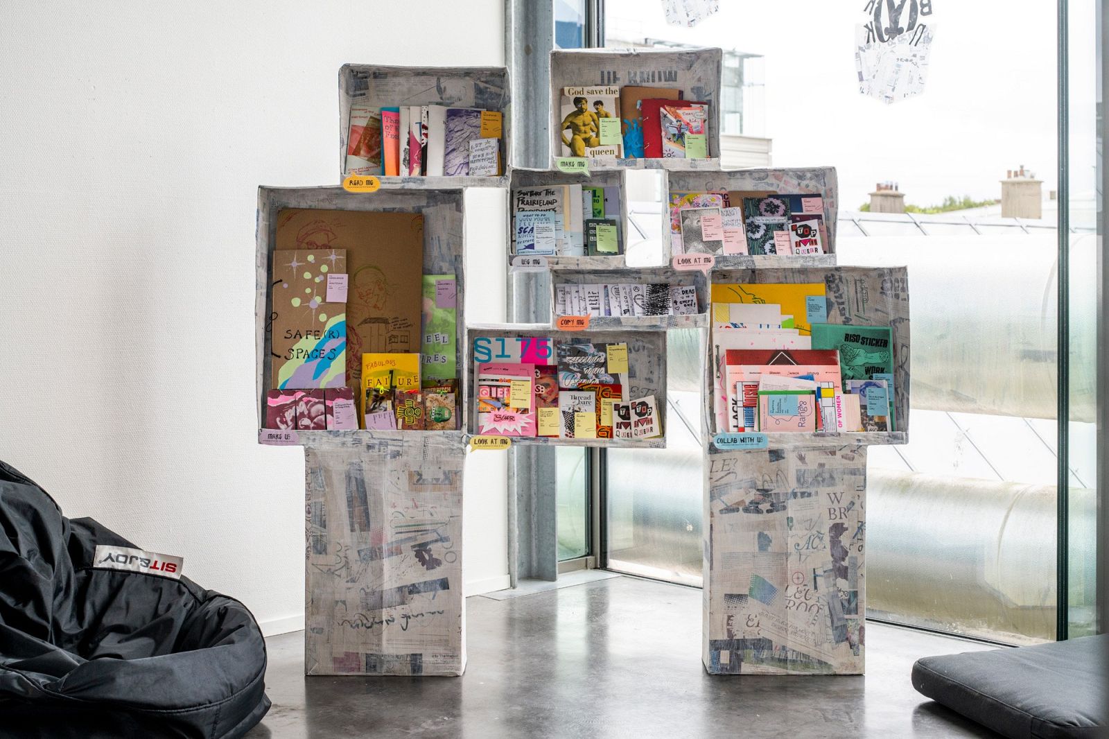 a papier-machee zine shelf